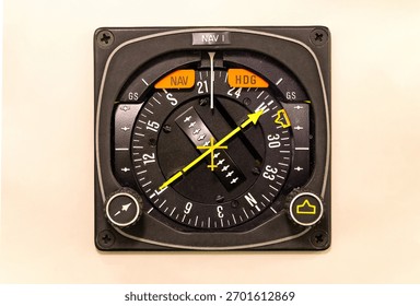 Horizontal Situation Indicator. Navigation instrument set in the dashboard of a general aviation aircraft. Course and deviation are indicated with a yellow arrow and needle.Avionics component airplane