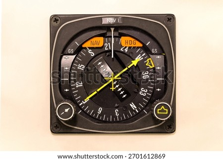 Horizontal Situation Indicator. Navigation instrument set in the dashboard of a general aviation aircraft. Course and deviation are indicated with a yellow arrow and needle.Avionics component airplane
