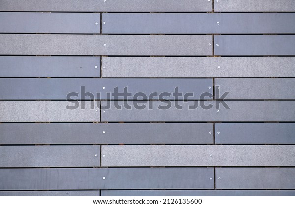 horizontal\
stripes are gray like textures on the\
wall