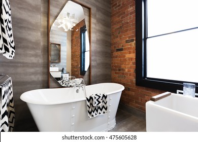 Horizontal Version Freestanding Vintage Style White Bath Tub In Renovated Warehouse Apartment