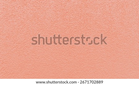 Horizontal view of abstract texture with small pimples of pastel pink wall of street facade,side view general plan.Concept beautiful backgrounds and textures.