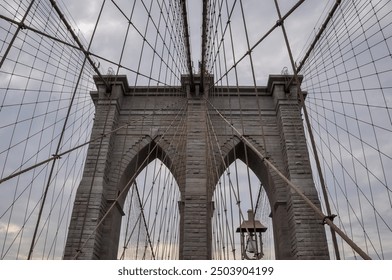 Horizontal view of Brooklyn bridge tower and arches - Powered by Shutterstock