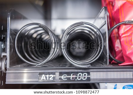 Horizontal View of Close Up of Empty Spirals inside the Snack Vending Machine on Blur Background