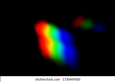 Horizontal view of conceptual rgb icon isolated on black background. Light reflection through a prism into red green and blue photography colors. Chromatic pattern of rainbow colors.