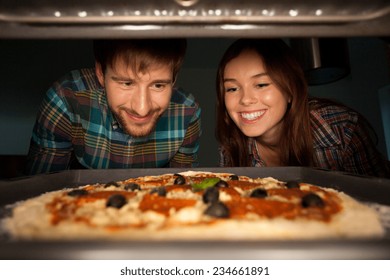 Horizontal view of delicious homemade pizza at oven - Powered by Shutterstock