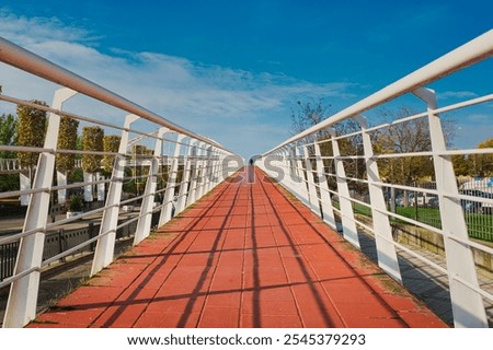 Horizontal view of an elevated pedestrian walkway in perspective, in Talavera de la Reina, Spain.
