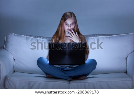 Horizontal view of girl surfing the internet