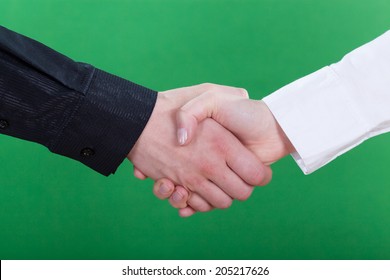 Horizontal view of handshake on green background - Powered by Shutterstock