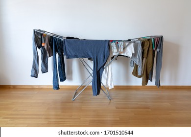 Horizontal View Of An Indoor Balcony Folding Clothes Drying Rack In An Empty Apartment Room