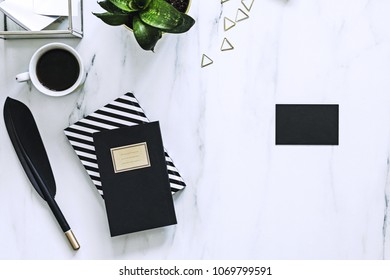 The Horizontal View Of Marble Desk With Cup Of Coffee, Plant And Notes. Concept For Mock Up Bussines Card.