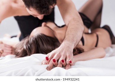 Horizontal View Of A Sexual Intercourse In Bed