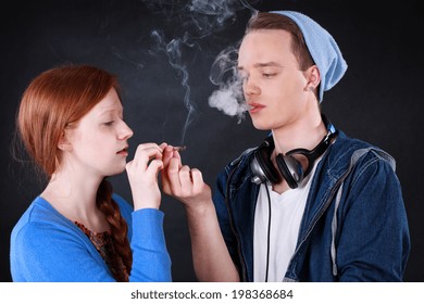 Horizontal View Of A Teenagers Smoking Marijuana Joint 