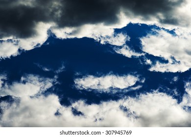 Horizontal vivid blue dramatic cloudscape background