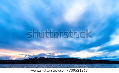 Horizontal vivid ocean cloudscape horizon land