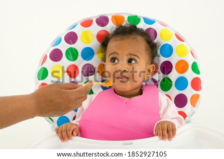 Mother feeding baby with baby bottle