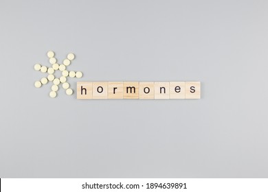 Hormones word wooden cubes. Medical concept. 