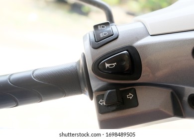 Horn button, high beam button, low turn signal button on left handle motorcycle. - Powered by Shutterstock