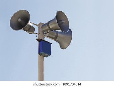 Horn speaker on top of pole                
