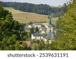 HORNI CERMNA (HORNÍ ČERMNÁ), CZECH REPUBLIC (CZECHIA) – AUGUST 31, 2024: View of the village centre with an evangelical church and nearby rectory building, Pardubice Region (Pardubický kraj)