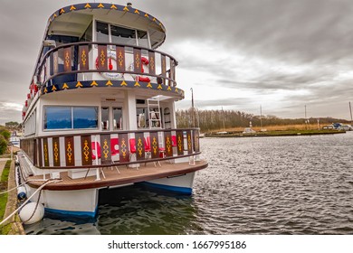 Horning, Norfolk, UK – March 07 2020. The rear view of the Southern Comfort replica paddle steamer moored up on the River Bure in the village of Horning