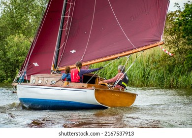 Horning, Norfolk, UK – May 28 2022. Pippa, A Traditional River Cruiser Sailing Boat On The River Bure Leg Of The 2022 Three Rivers Race, An Annual Boat Race Held On The Norfolk Broads