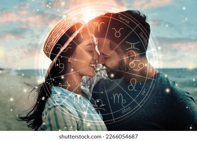 Horoscope compatibility. Loving couple on beach and zodiac wheel - Shutterstock ID 2266054687