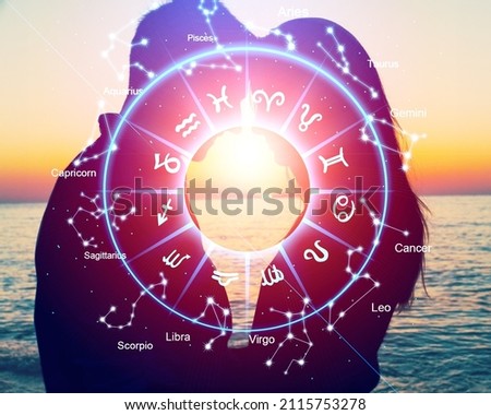 Horoscope concept, couple guy and girl and a circle with the signs of the zodiac, astrology.