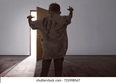 Horrible Asian Zombie Man With Claw Hand Walking To Open Door