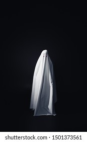 Horrible Ghost In White Bedsheet Isolated On Black With Copy Space