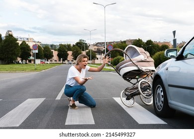 Horrified Mother On The Crosswalk After A Car Accident When A Vehicle Hits Her Baby Pram. Concepts Of Safety, Traffic Code And Insurance.