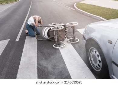 Horrified Mother On The Crosswalk After A Car Accident When A Vehicle Hits Her Baby Pram. Concepts Of Safety, Traffic Code And Insurance.