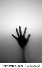 Horror Background. Silhouette Of A Hand Behind The Window. 