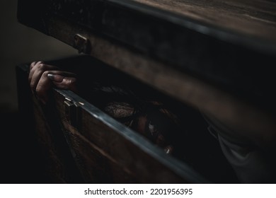 Horror Ghost Woman. Asian Ghost Horror Creepy Scary Hair Covering Face And Eye Lying In The Old Treasure Chest She Look At Camera, Female Makeup Terror Zombie Face, Murder, Happy Halloween Day Concept