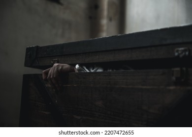 Horror Ghost Woman. Asian Ghost Horror Creepy Scary Have Hair Covering Face And Eye Lying In The Old Treasure Chest, Female Makeup Terror Zombie Face, Murder, Closeup Hand, Happy Halloween Day Concept