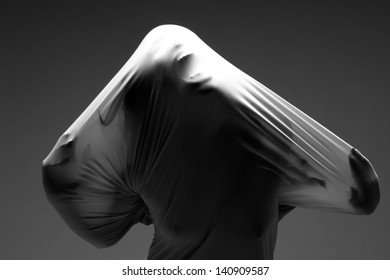 Horror Image of a Woman Trapped in Fabric
