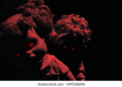 Horror Red Toned Photo Of Scary Possessed Plastic Dolls With Glowing Red Eyes On Dark Background.