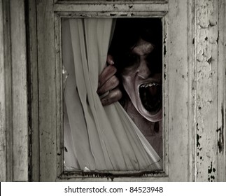 Horror Scene Of A Scary Woman Peeking Out Of A Small Window Focus Is On Mouth