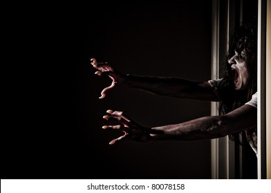 Horror Scene of a Woman Possessed Grabbing out of Doorway