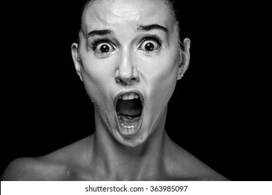 Horror Scene Of A Woman Screaming On Black Background