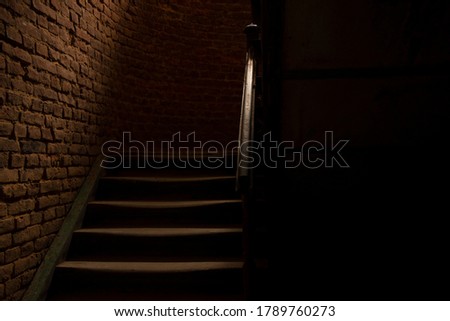 horror style dark hall and stairs path way corridor indoor space and brick wall background in photography with lights and shadows 