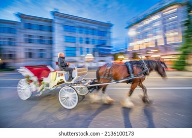 Horse Carriage In The City Center At Night, Blurred Fast Movement Of Horse