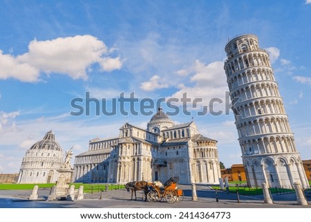 Horse with carriage on the square with Pisa leaning tower and cathedrals, Italy