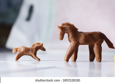 Horse Clay Model. The mother horse is talking to her baby. This educative toy could deliver powerful storytelling and stimulate children creativity.  - Shutterstock ID 1892528185