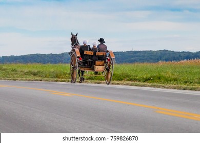 Horse Drawn Amish Buggy Traveling Down Pennsylvania Road