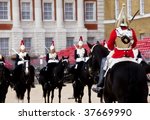 Horse guards in front each others.