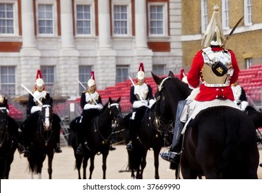 Horse guards in front each others.