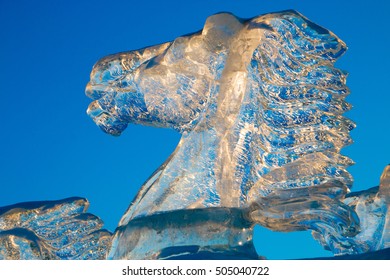 Horse Ice Sculpture Head With Blue Sky And Sunset.