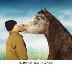 Horse Kissing Man In Jacket And Hat