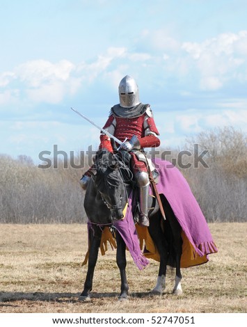 The horse knight with a sword in a hand