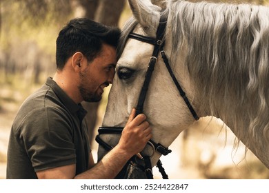 Horse and man affectionately putting their heads together. Connection between man and nature. Love for animals - Powered by Shutterstock